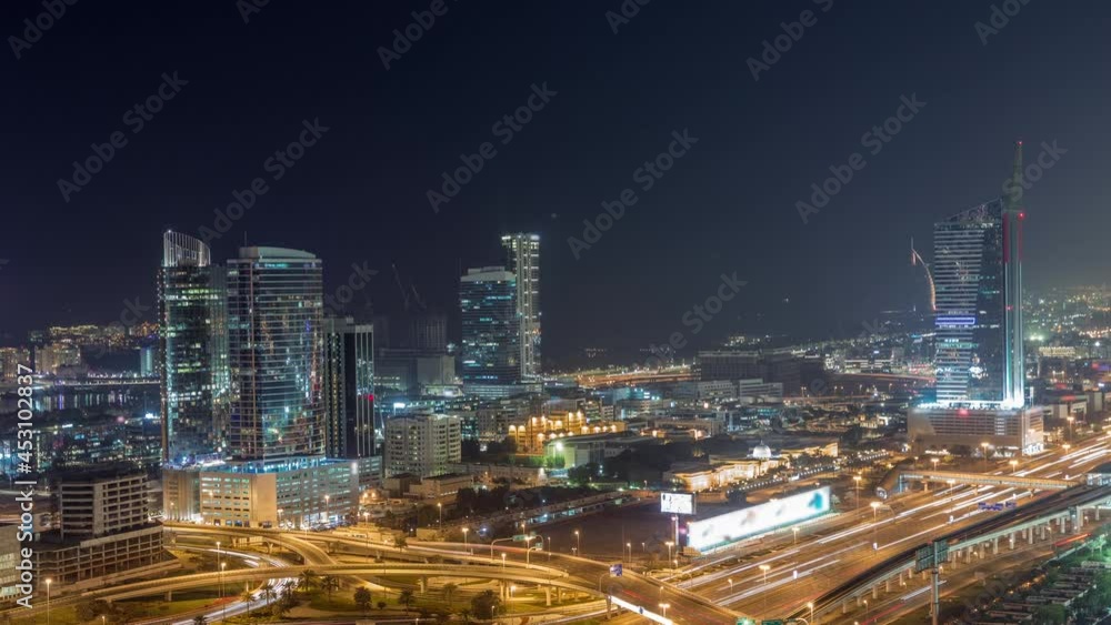 Highway crossroad and office buildings in Dubai Internet City and Media City district aerial night timelapse Highway crossroad and office buildings in Dubai Internet City and Media City district aerial night timelapse