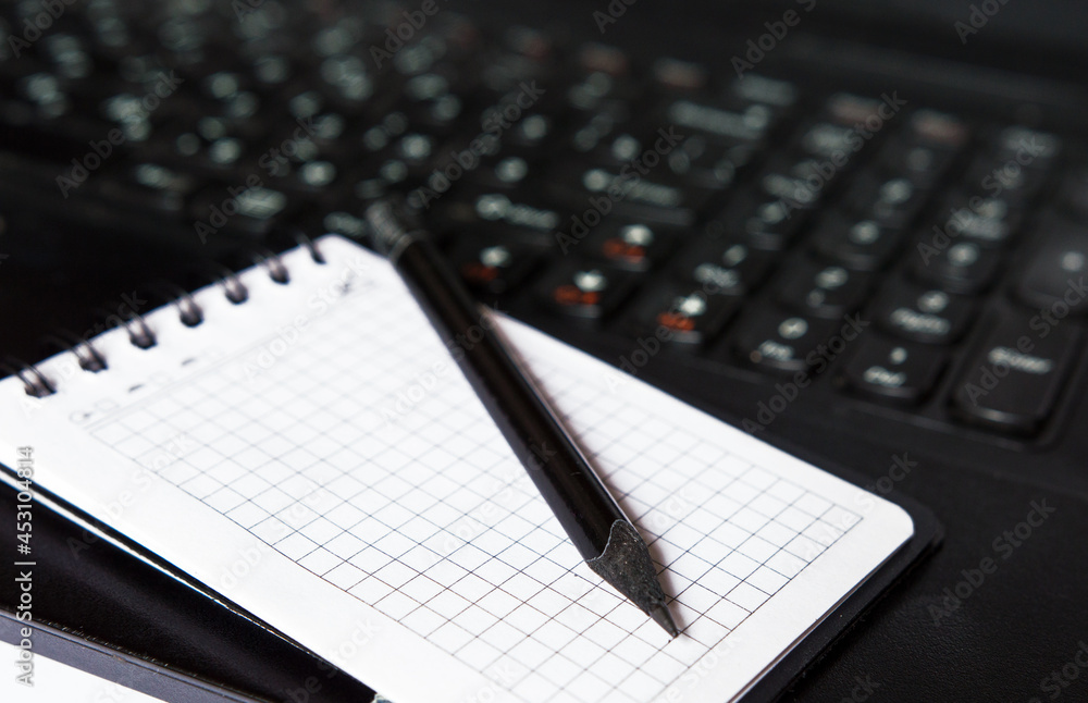notebook and pen on the table notebook and pen on the table