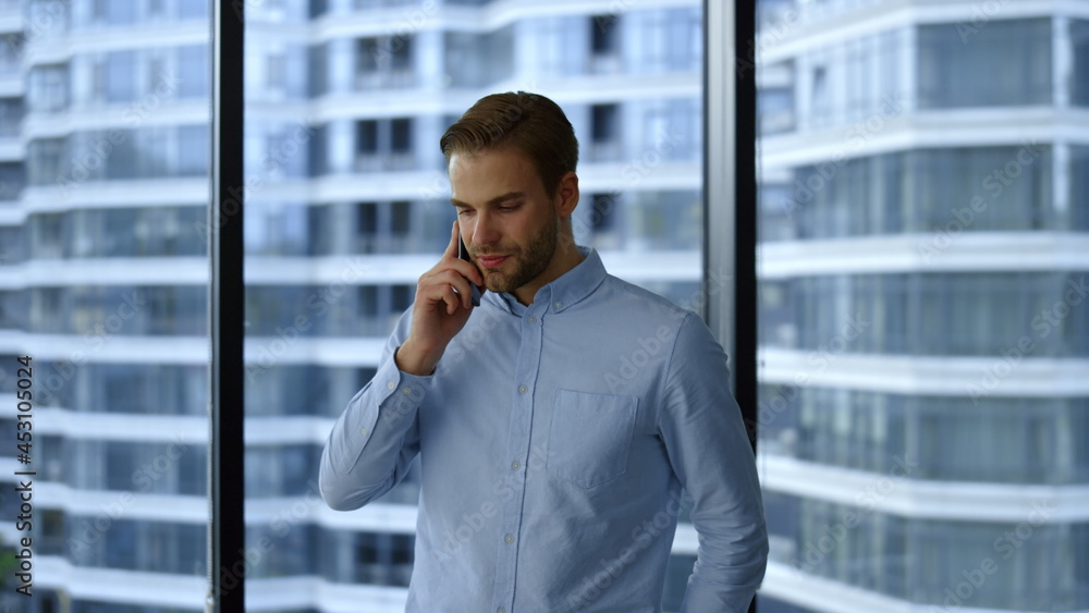 Serious businessman calling on smartphone. Professional talking on mobile phone Serious businessman calling on smartphone. Professional talking on mobile phone