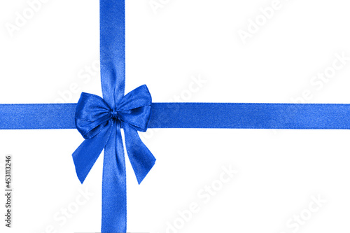 Beautiful blue satin ribbon with bow isolated on white.