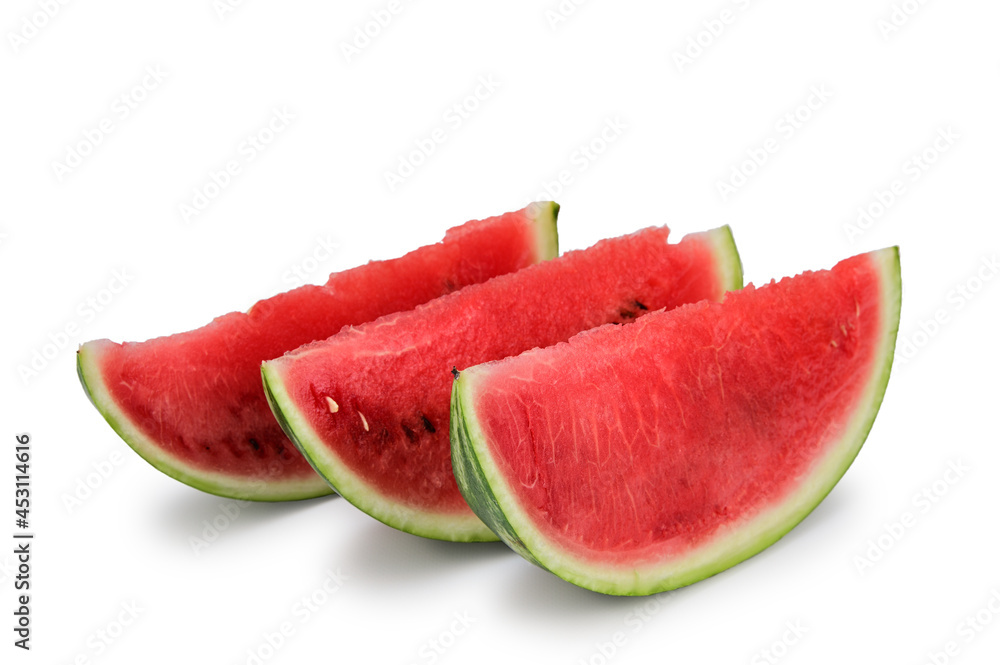 Three slices cut from a ripe red watermelon stand vertically next to each other. Isolated on white background Three slices cut from a ripe red watermelon stand vertically next to each other. Isolated on white background