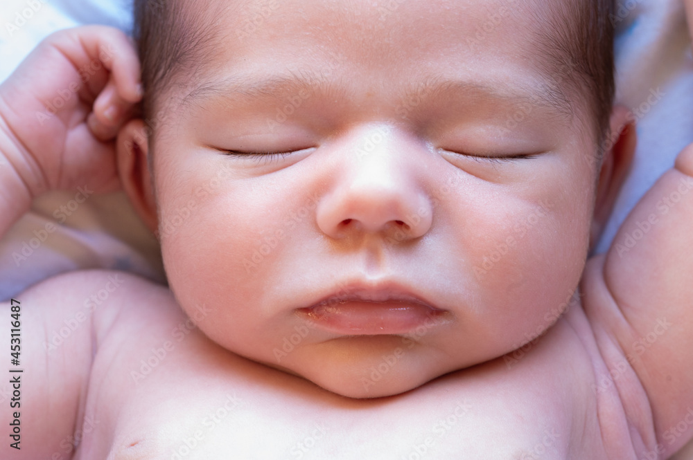 Cute newborn sleeping on bed Cute newborn sleeping on bed