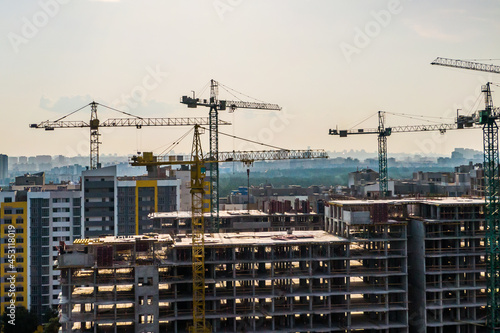 Wallpaper Mural building cranes working and sunset sky. housing estate development. general view. Torontodigital.ca
