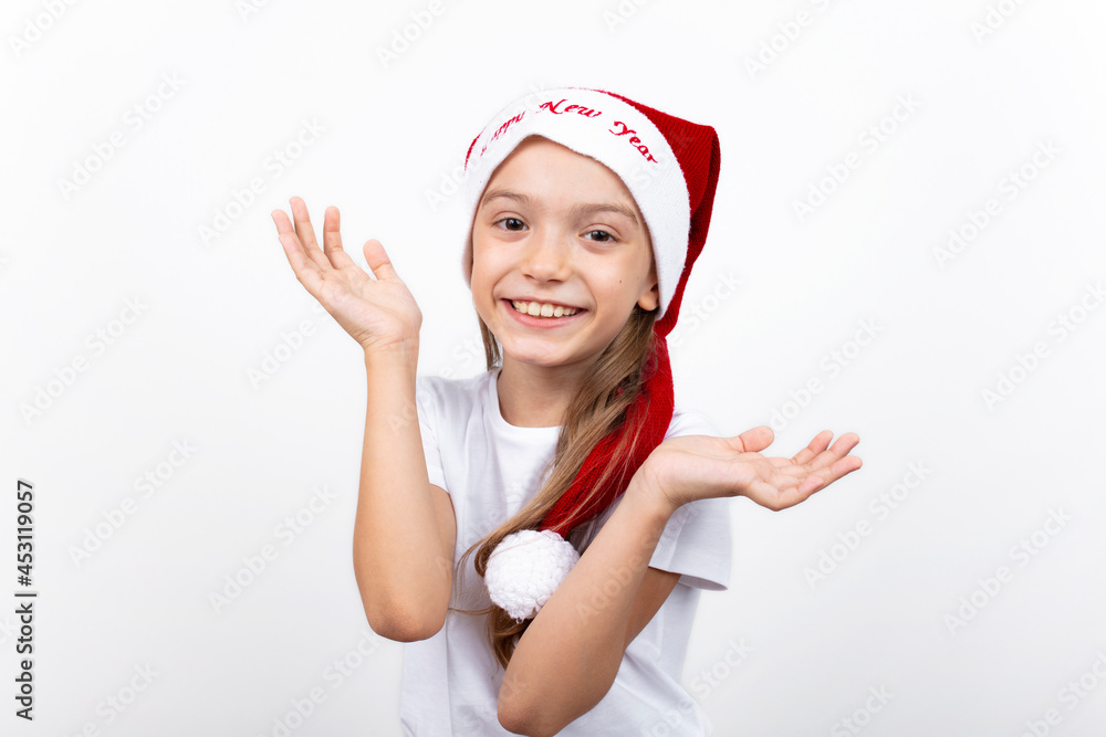 Little caucasian girl in santa hat on white background. Happy smiling kid. christmas design empty copy space.Child's portrait. Little caucasian girl in santa hat on white background. Happy smiling kid. christmas design empty copy space.Child's portrait.