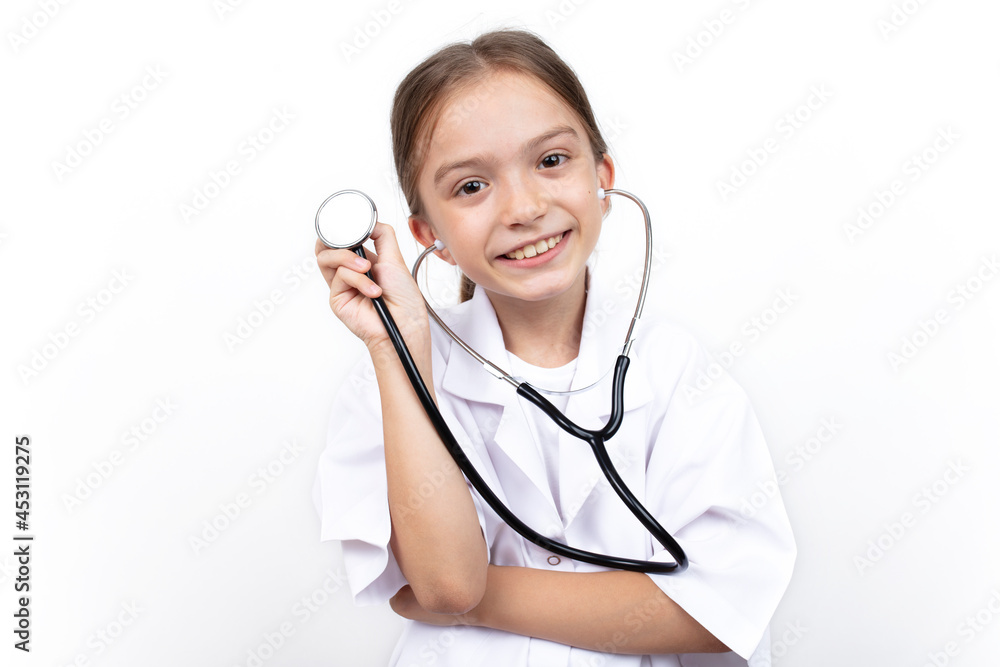 Portrait of child girl dressed in white doctor costume with stethoscope. isolated on white background.
Portrait of child girl dressed in white doctor costume with stethoscope. isolated on white background.