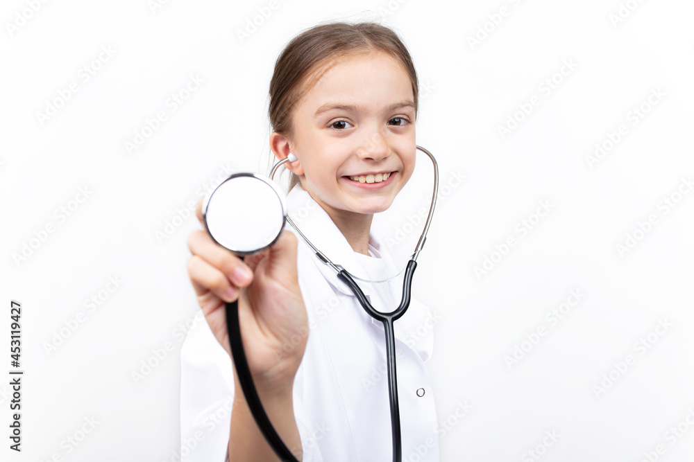 Portrait of child girl dressed in white doctor costume with stethoscope. isolated on white background.
Portrait of child girl dressed in white doctor costume with stethoscope. isolated on white background.