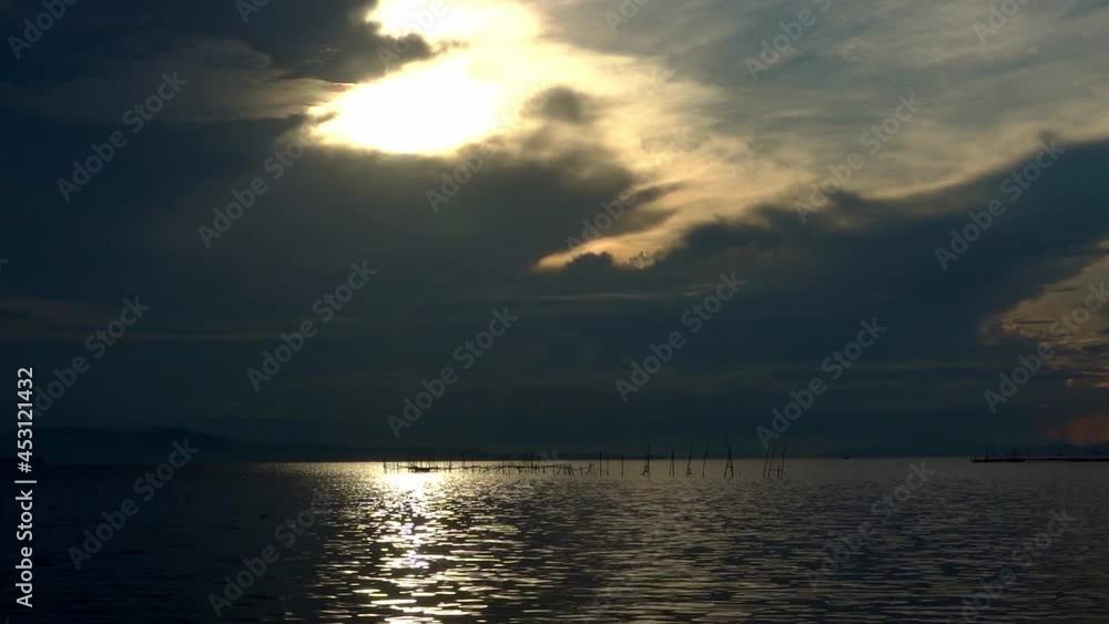 Dawn over the Gulf of Leyte and the Surigao Strait in the Philippines. Calm and tranquil tropical ocean waters. Dawn over the Gulf of Leyte and the Surigao Strait in the Philippines. Calm and tranquil tropical ocean waters.