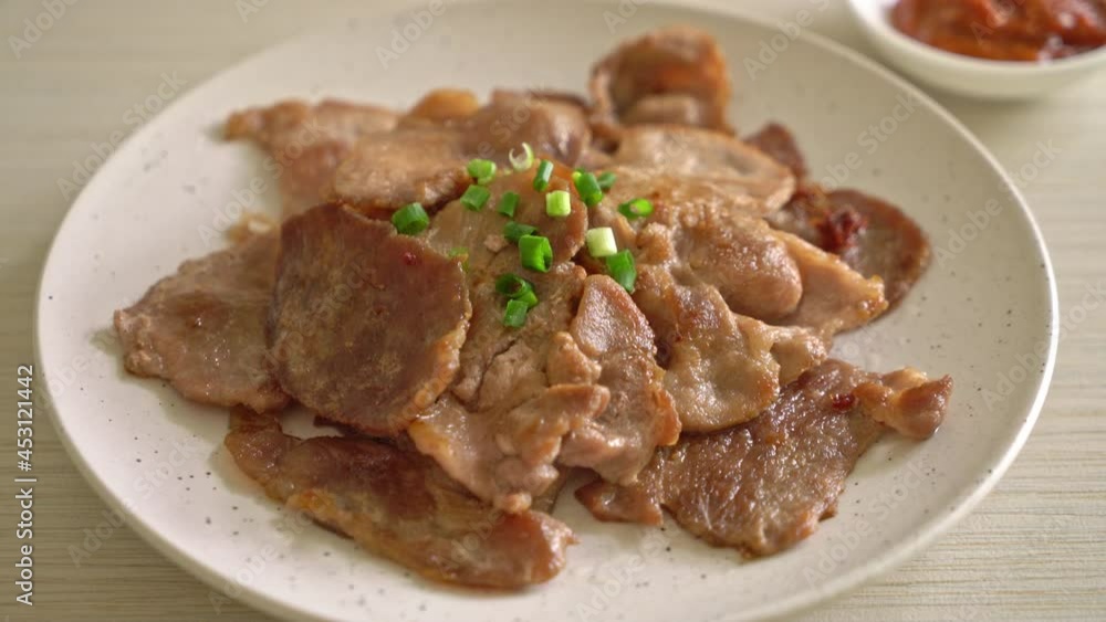 grilled pork neck sliced on plate in Asian style grilled pork neck sliced on plate in Asian style