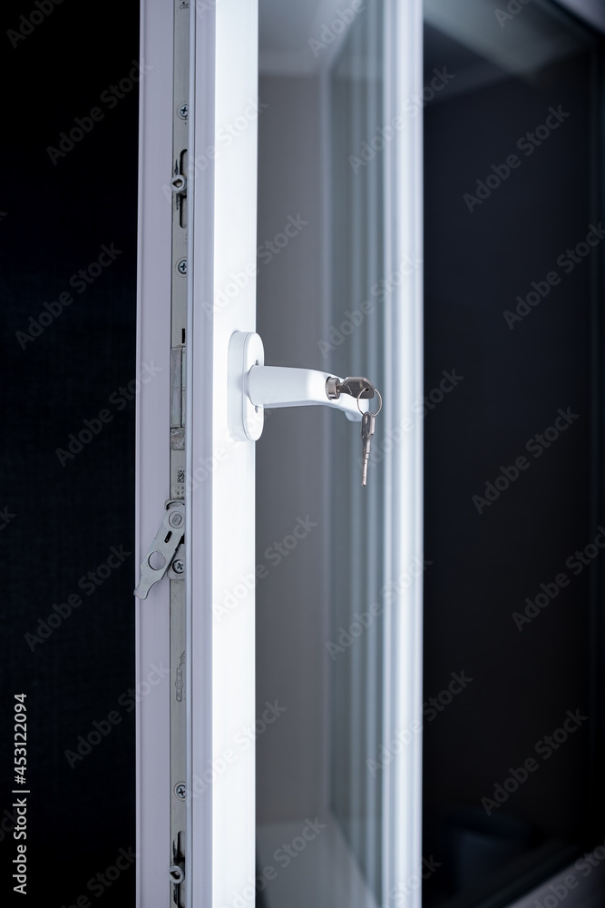 White UPVC window with lockable handle White UPVC window with lockable handle
