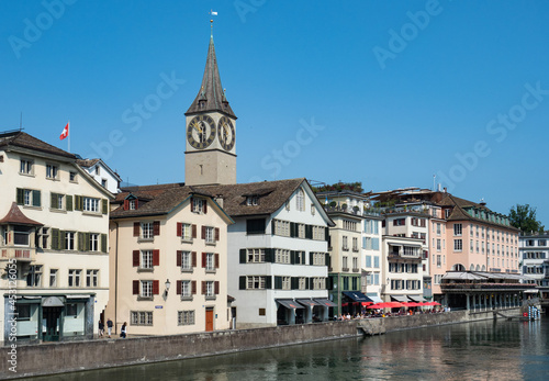 Zurich, Switzerland - August 20th 2021: Old town centre at the waterfront of the Limmat river