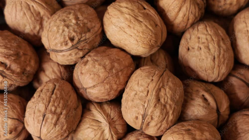 Close up of a pile of walnuts rotating Close up of a pile of walnuts rotating