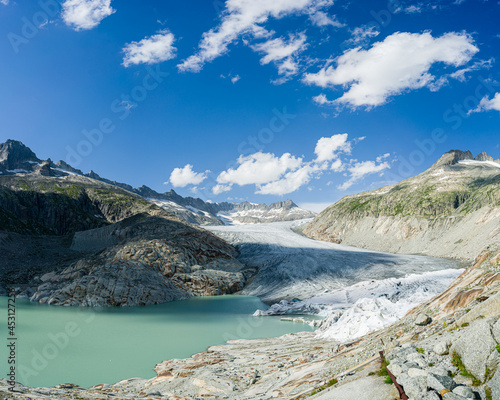 View of the head of the Rhonegletcher Glacier in Switzerland. There is a glacier lake below.