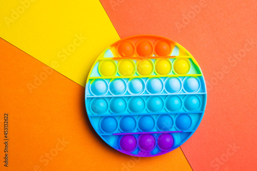 Pop it anti-stress on a colored background. Modern toys. Toys for children. Silicone game. Autism. Copy space