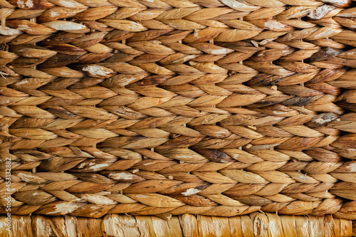 natural background wicker basket close up in light brown tones,