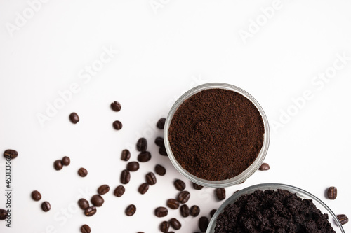 Coffee grounds for scrub massaging cosmetic skincare on white background.