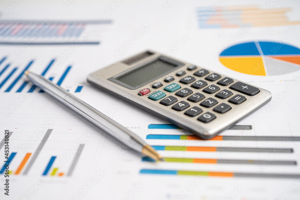 Calculator on graph paper. Finance development, Banking Account, Statistics, Investment Analytic research data economy, Stock exchange trading, Business company concept. Calculator on graph paper. Finance development, Banking Account, Statistics, Investment Analytic research data economy, Stock exchange trading, Business company concept.