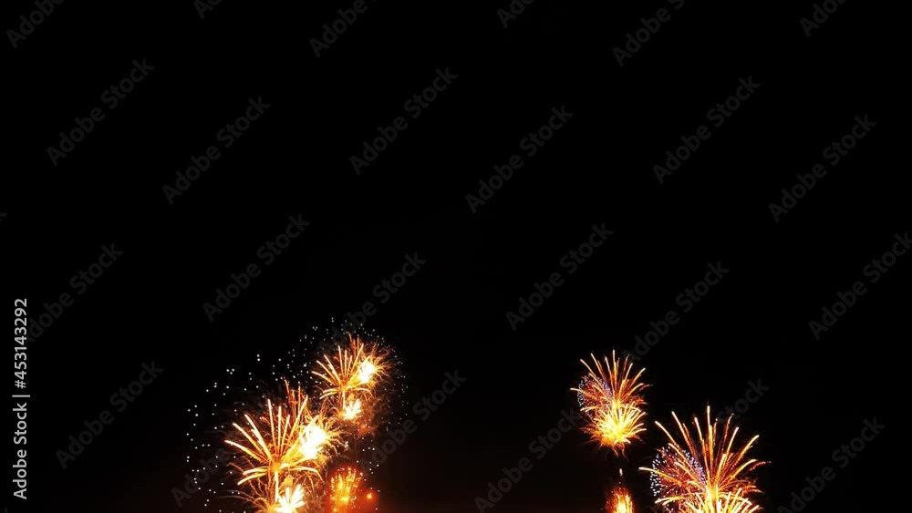 4K fireworks background. New year's eve fireworks celebration. real golden shining fireworks display with bokeh lights in the night sky. glowing fireworks show. 4K fireworks background. New year's eve fireworks celebration. real golden shining fireworks display with bokeh lights in the night sky. glowing fireworks show.