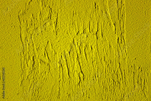 Yellow abstract background with plaster texture. Empty surface. Back for design.