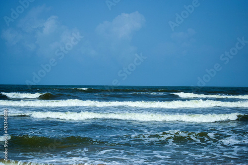 Ocean-Sea Waves, Mountains Rock Stones and Sky Blue Landscape Background © Pleasant Mode Studio
