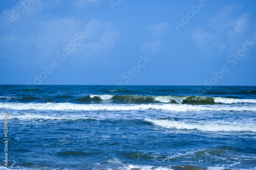 Ocean-Sea Waves, Mountains Rock Stones and Sky Blue Landscape Background