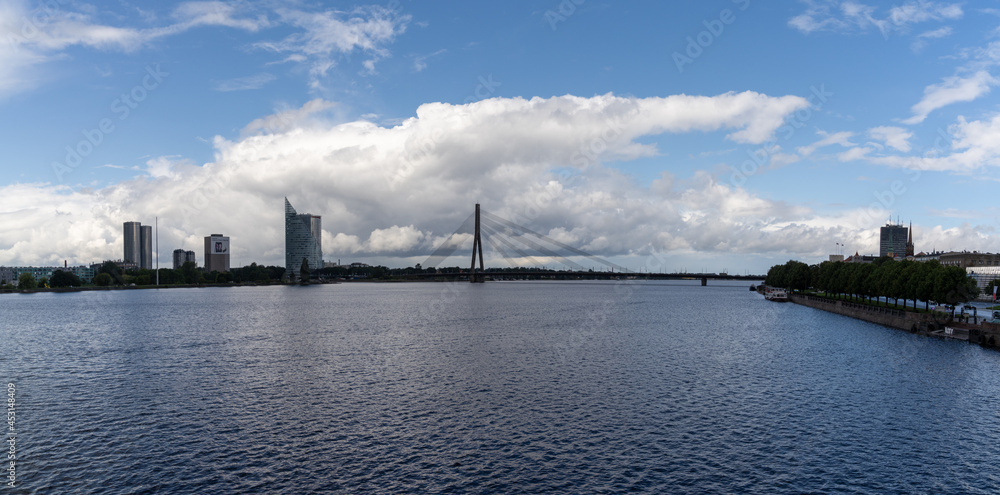 the Daugava River and Akmens Tilts Bridge with the skyline of Riga in the background