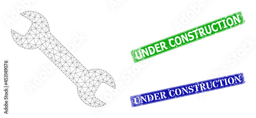Triangular spanner tool image, and Under Construction blue and green rectangular corroded stamp seals. Polygonal wireframe image is based on spanner tool icon.