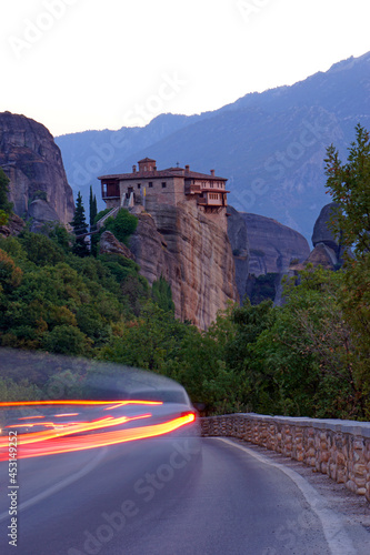 Monastery in the evening with fast cars