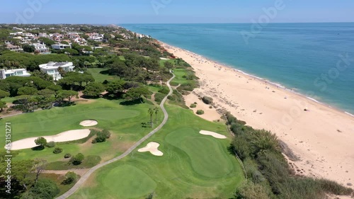 Aerial video shooting of a tourist village on the Atlantic Ocean, with golf courses, Vale de Lobo. Portugal Algarve.