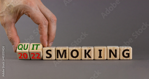 Wallpaper Mural Quit smoking 2022 new years resolution symbol. Businessman turns wooden cubes with words '2022 quit smoking'. Beautiful grey background, copy space. Healthy lifestyle and 2022 quit smoking concept. Torontodigital.ca