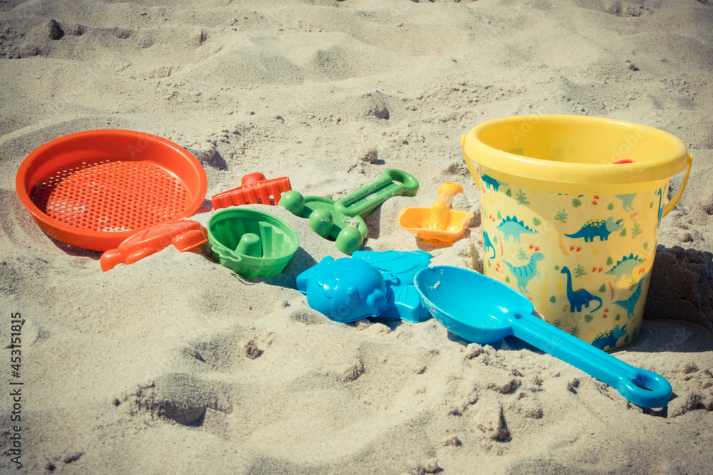 Children toys for relax or playing on sand at beach. Vacation time Children toys for relax or playing on sand at beach. Vacation time