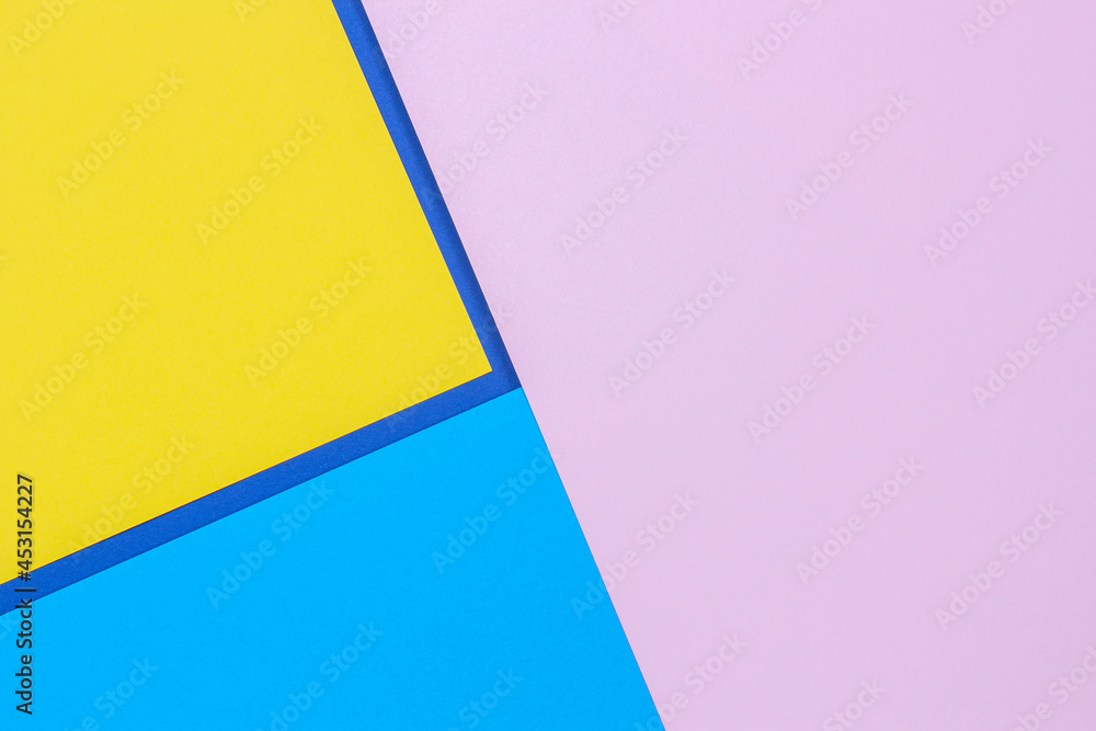 Creative abstract blue, pink and yellow color geometric paper compositon background, top view Creative abstract blue, pink and yellow color geometric paper compositon background, top view