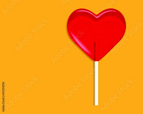 heart lollipop candy isolated on a orange background