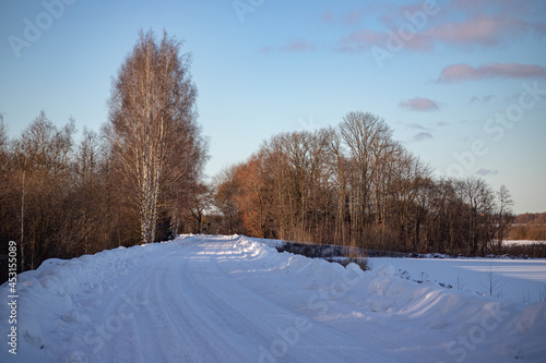 slippery forest country road in Latvian woods and fields December, January, February common usual landscape in northern Europe plains 