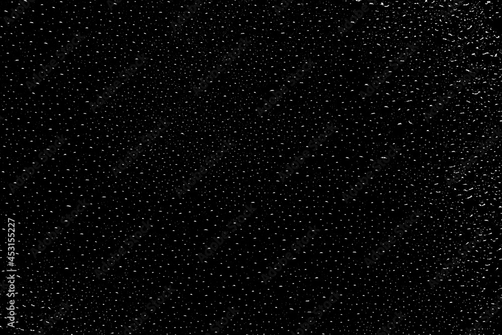 Black and white background with dots. Background with black droplets. Black and white image of an enormous number of water droplets on black surface. Top view Black and white background with dots. Background with black droplets. Black and white image of an enormous number of water droplets on black surface. Top view