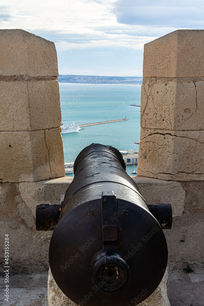 Cannon of the fortified castle of Alicante in vertical view 