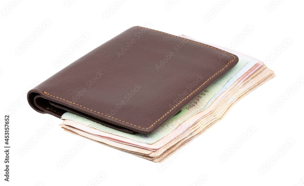 Brown genuine leather wallet with banknotes isolated on white background. Brown genuine leather wallet with banknotes isolated on white background.