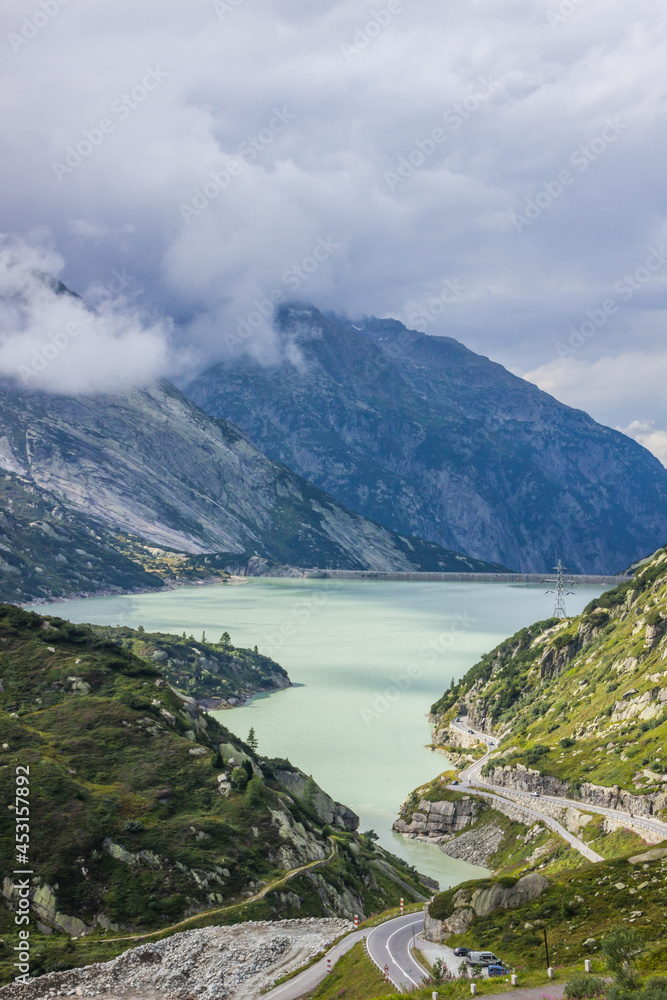 clouds over Grimsel Pass and lake in Switzerland