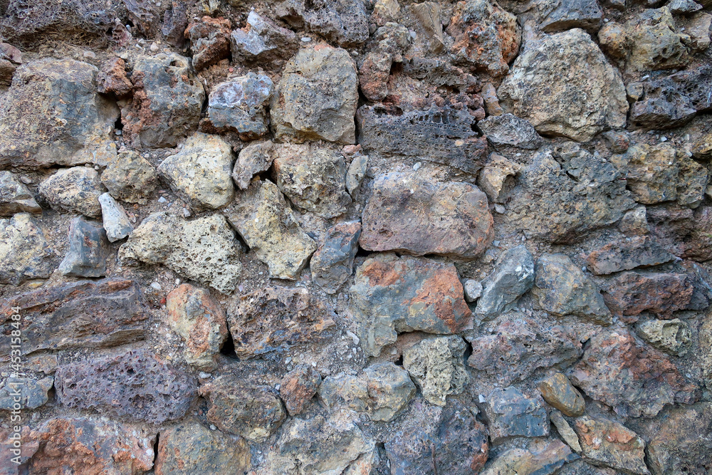 Obraz premium Close up of dark natural stone wall