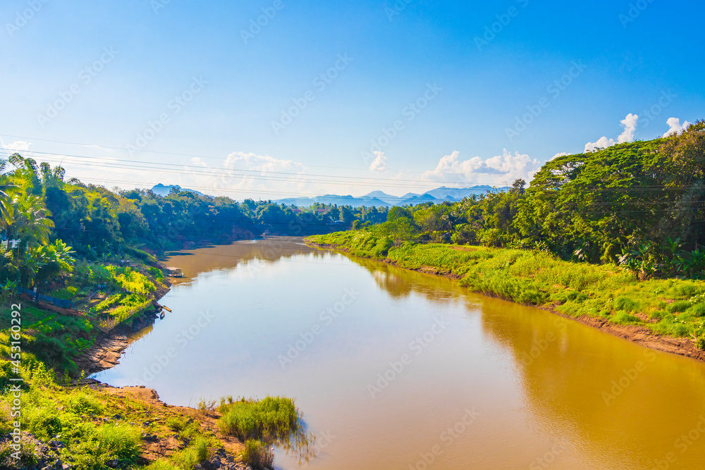 Naklejka premium Luang Prabang city in Laos landscape panorama with Mekong river.