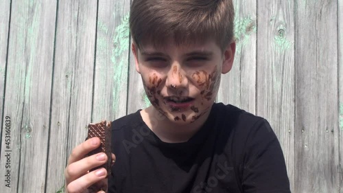 Boy smeared with chocolate cream