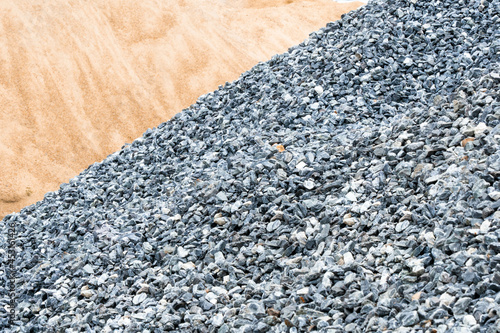 Stone or Concrete Mixer.Gravel pile and Sand pile, make concrete , to mix with asphalt , to create road or path, to create floor and  garden, gravel pine. texture , backgrounds and isolated.