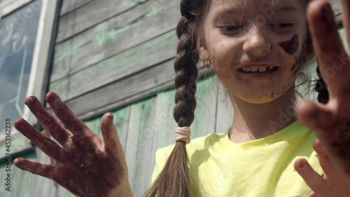 Girl smeared in the chocolate