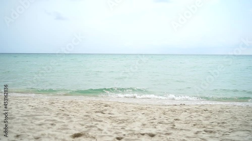 Beach and sea wave in cloudy day 