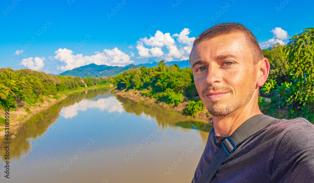 Young tourist with landscape Mekong river and Luang Prabang Laos.