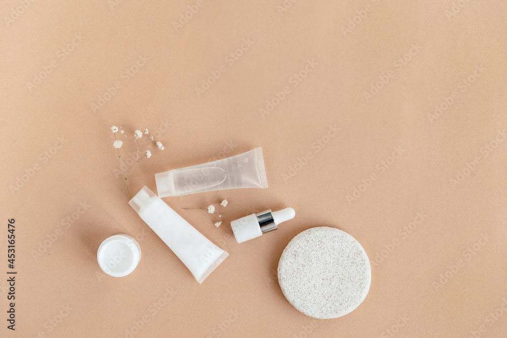 face and body care products flat lay on beige background face and body care products flat lay on beige background