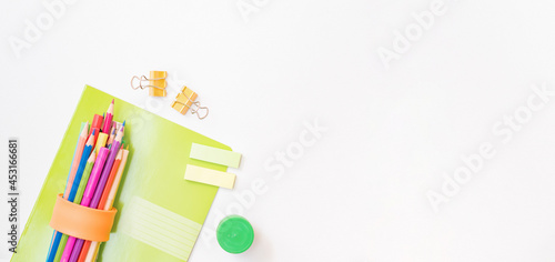Flat lay frame with school and office supplies on a white background