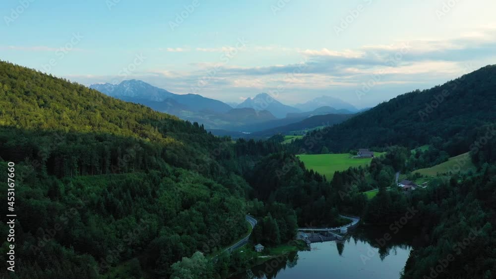 Green meadows, alpine houses and mountain peaks, Salzburger area, Austria. Green meadows, alpine houses and mountain peaks, Salzburger area, Austria.