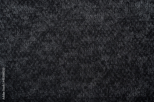 Cloth. The background is made of dark colored fabric. A texture or pattern from a material. A piece of fabric for the work of a designer, fashion designer or seamstress. Wool © Vadzim