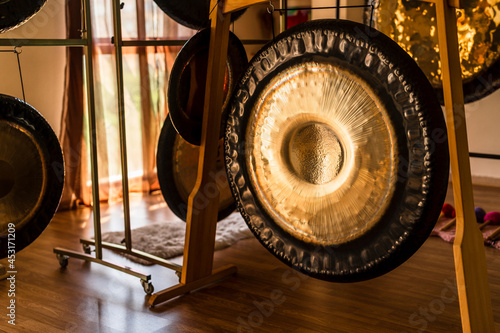 Set of musical instruments and gongs in room prepared for meditation and yoga