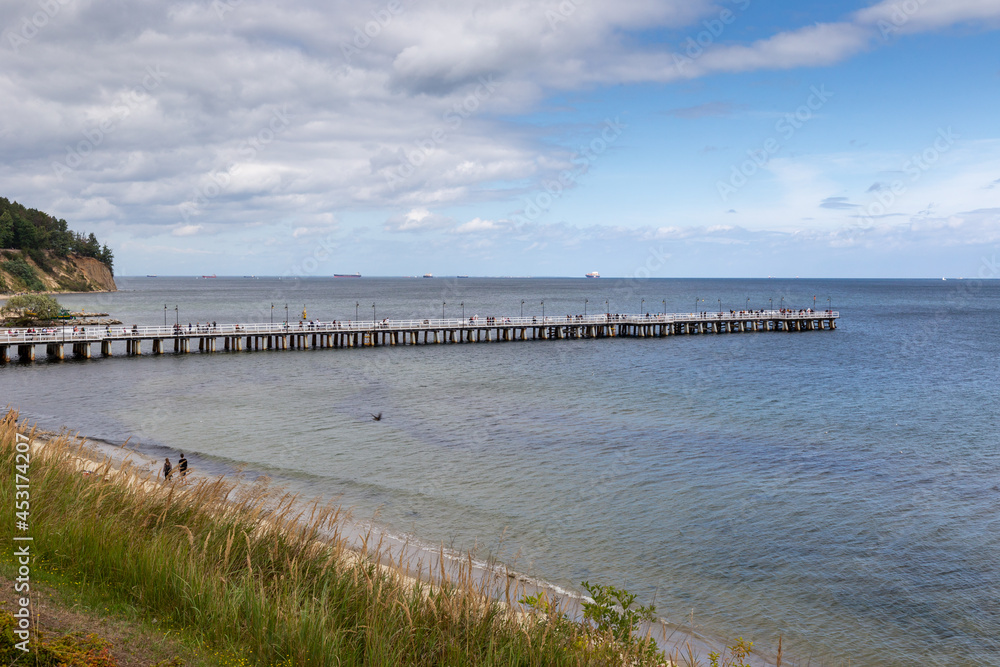 Pier in Gdynia in Poland on cloudy sky in summer